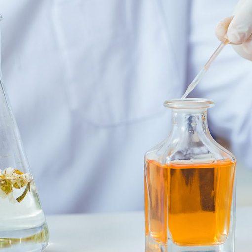 A perfume makers extracts ingredients to create a fragrance.