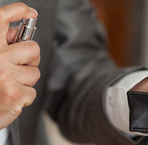 Man applying cologne