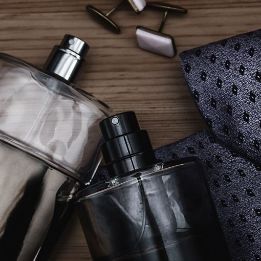 selection of colognes and a mens tie