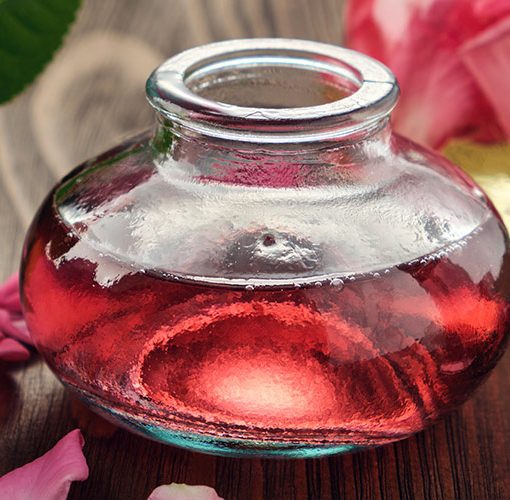 perfume being refilled into bottle
