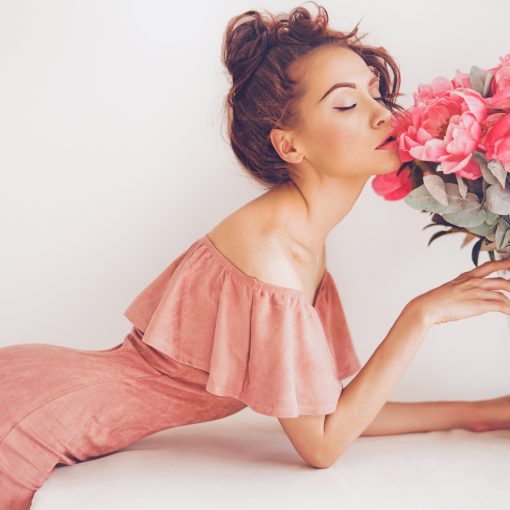 Woman smelling flowers for valentines day