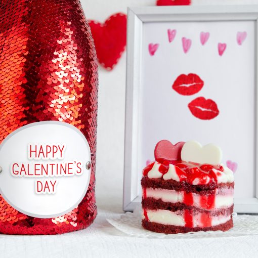 bottle of wine dressed in a red sequin that says "Happy Galentine's Day"