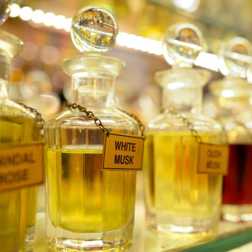 row of vintage perfume bottles