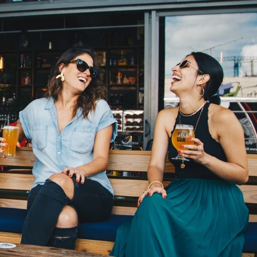 Girls smiling at a bar