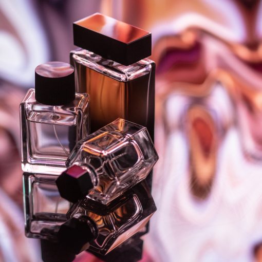 Three colognes on an abstract background