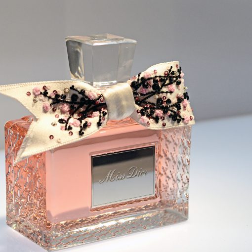 Christian Dior Miss Dior perfume on a white surface