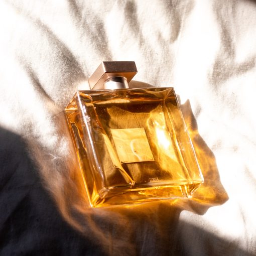 square perfume bottle with golden glow