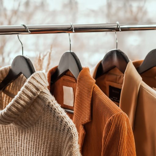 fall clothing hanging on a clothing rack