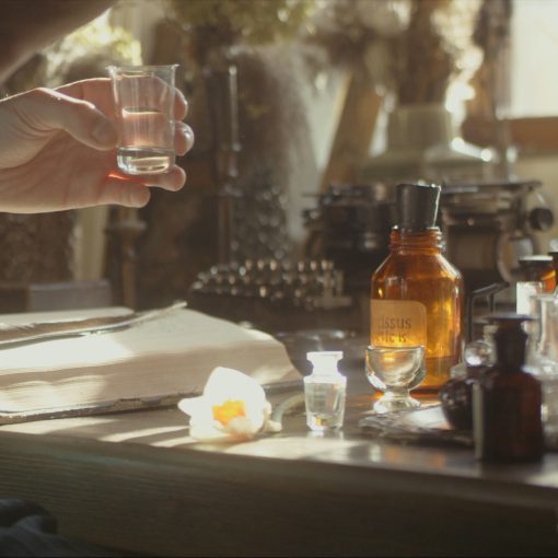 A close-up of a perfumer at her desk